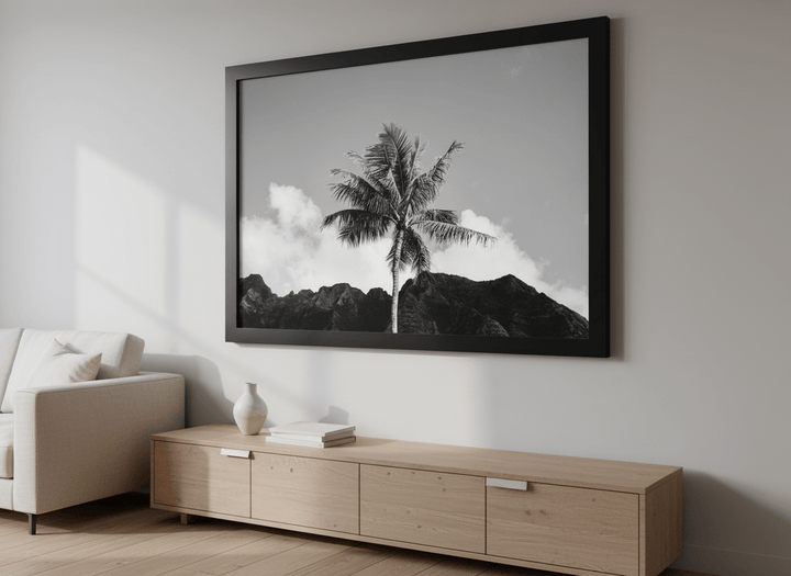 Modern wall art styled above a sofa in a neutral living room