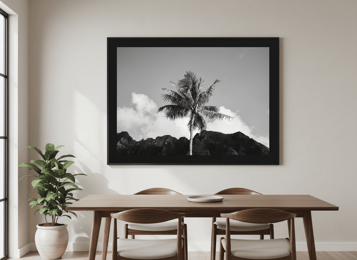 Wall art styled above a dining table in a contemporary home