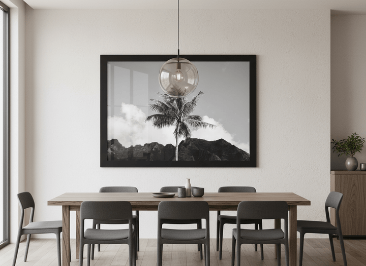 Wall art styled above a dining table in a contemporary home
