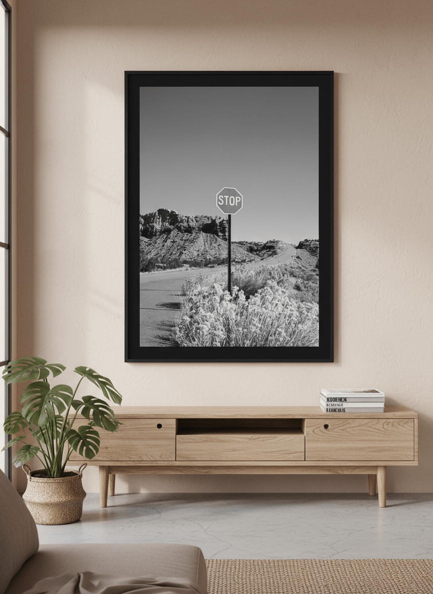 Modern wall art styled above a sofa in a neutral living room