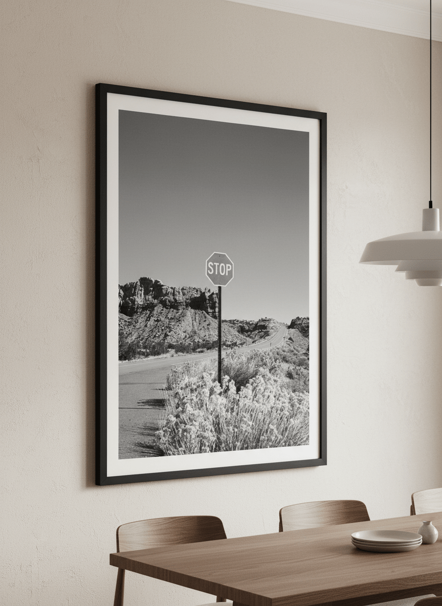 Wall art styled above a dining table in a contemporary home