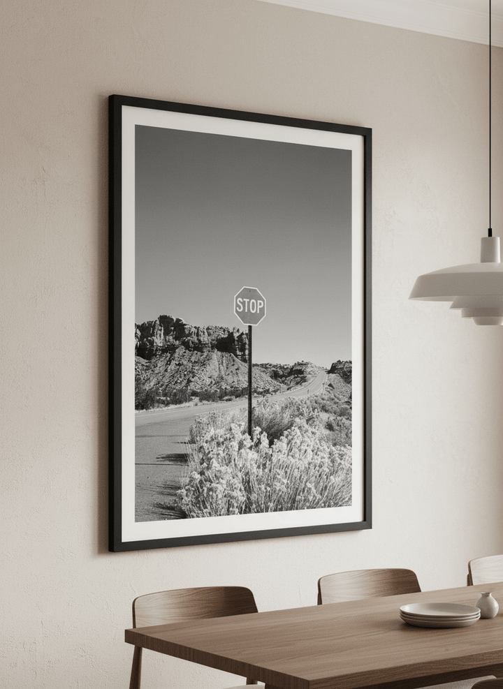 Wall art styled above a dining table in a contemporary home