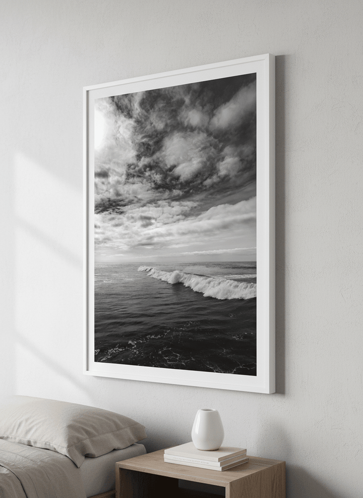 Minimalist artwork displayed in a calm, light-filled bedroom interior