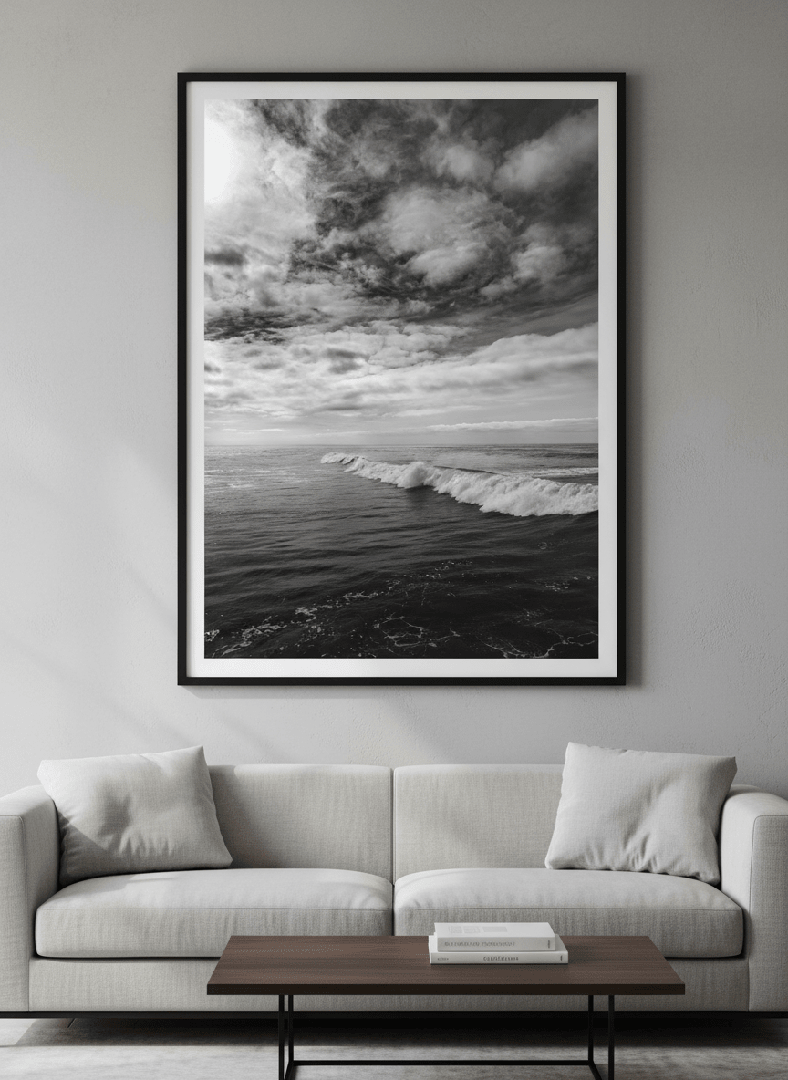 Modern wall art styled above a sofa in a neutral living room