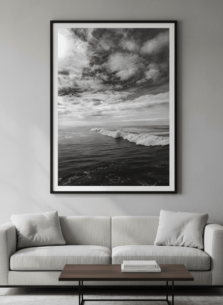 Modern wall art styled above a sofa in a neutral living room