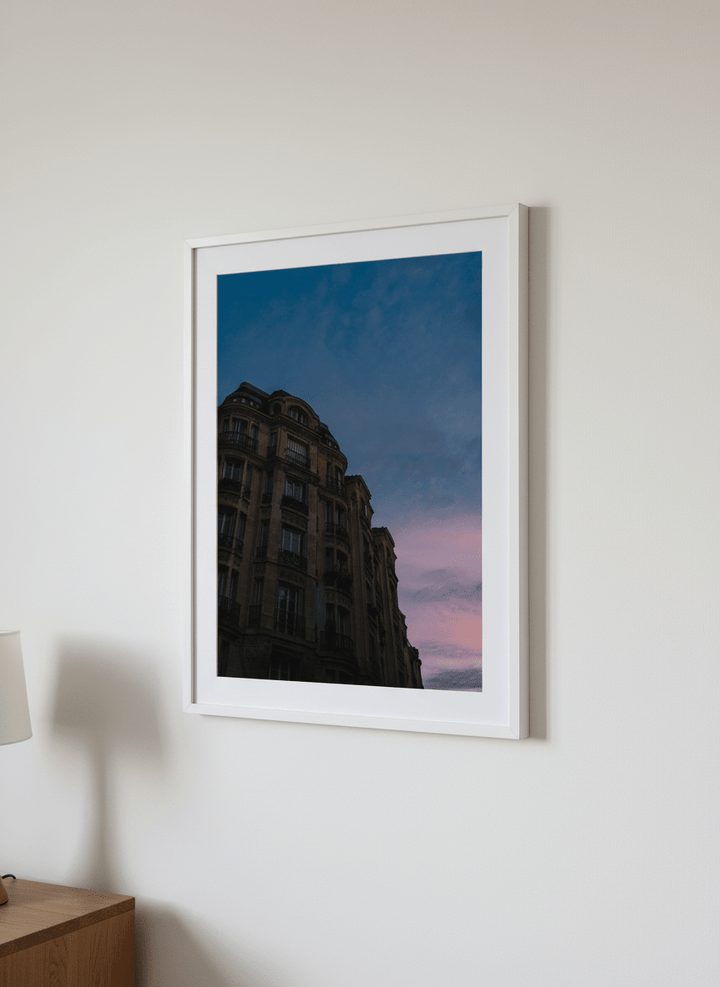 Minimalist artwork displayed in a calm, light-filled bedroom interior