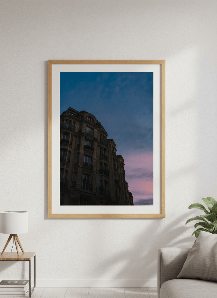 Modern wall art styled above a sofa in a neutral living room