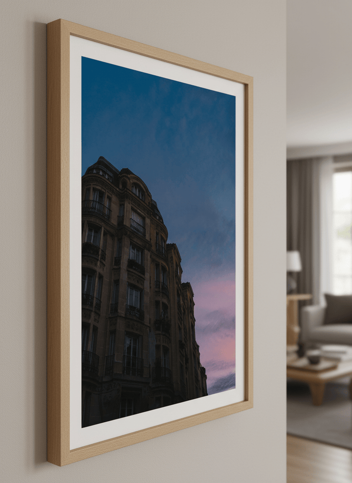 Modern wall art styled above a sofa in a neutral living room