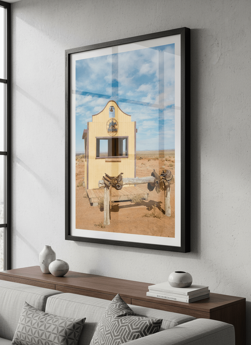 Modern wall art styled above a sofa in a neutral living room