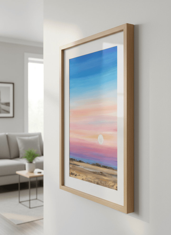 Modern wall art styled above a sofa in a neutral living room