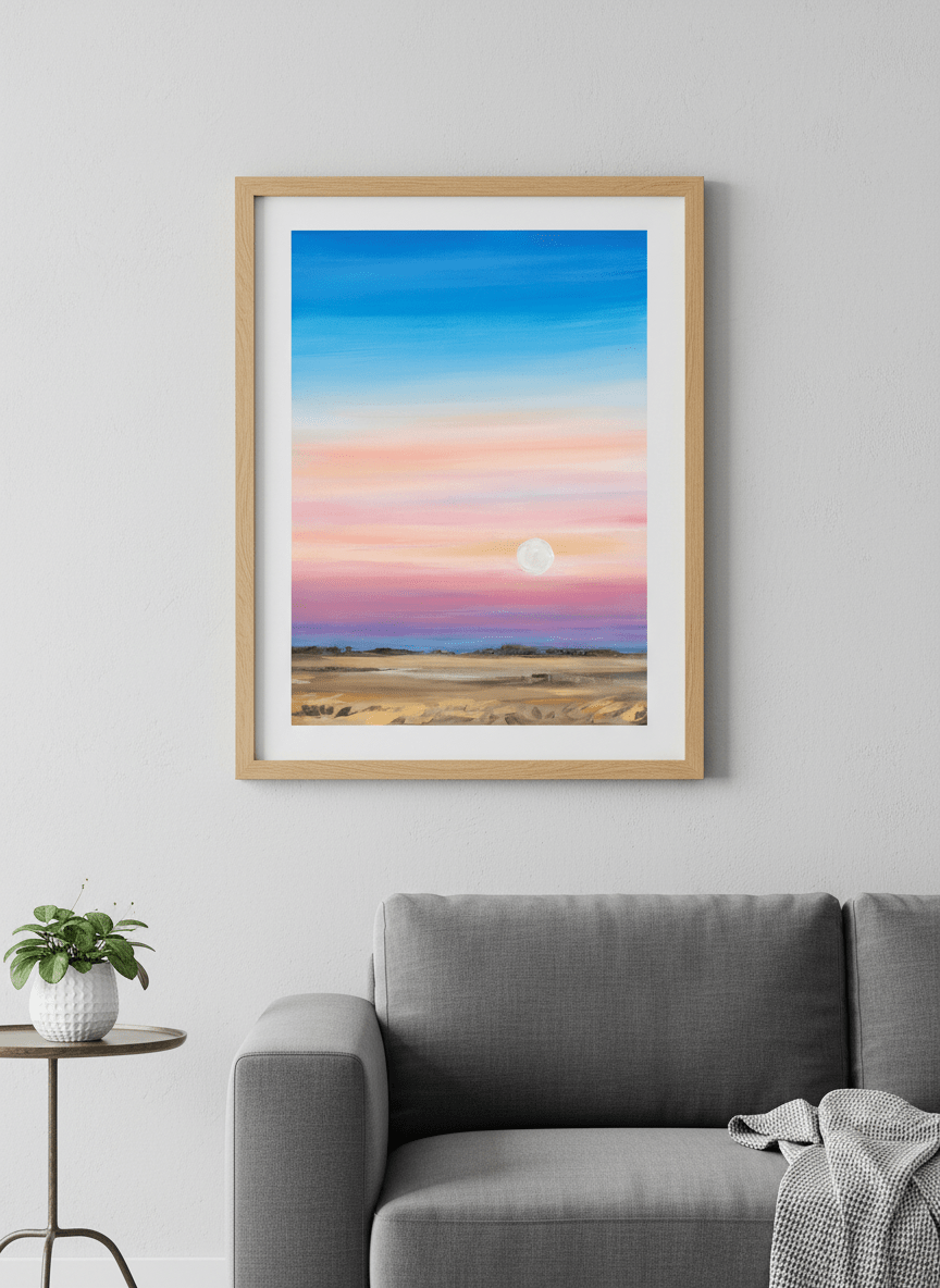 Modern wall art styled above a sofa in a neutral living room