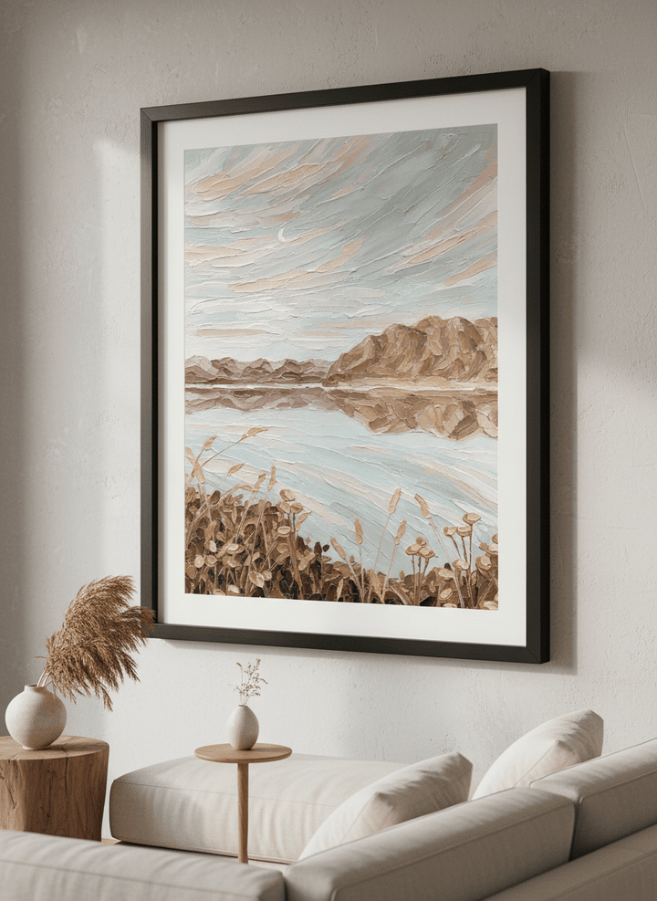 Modern wall art styled above a sofa in a neutral living room