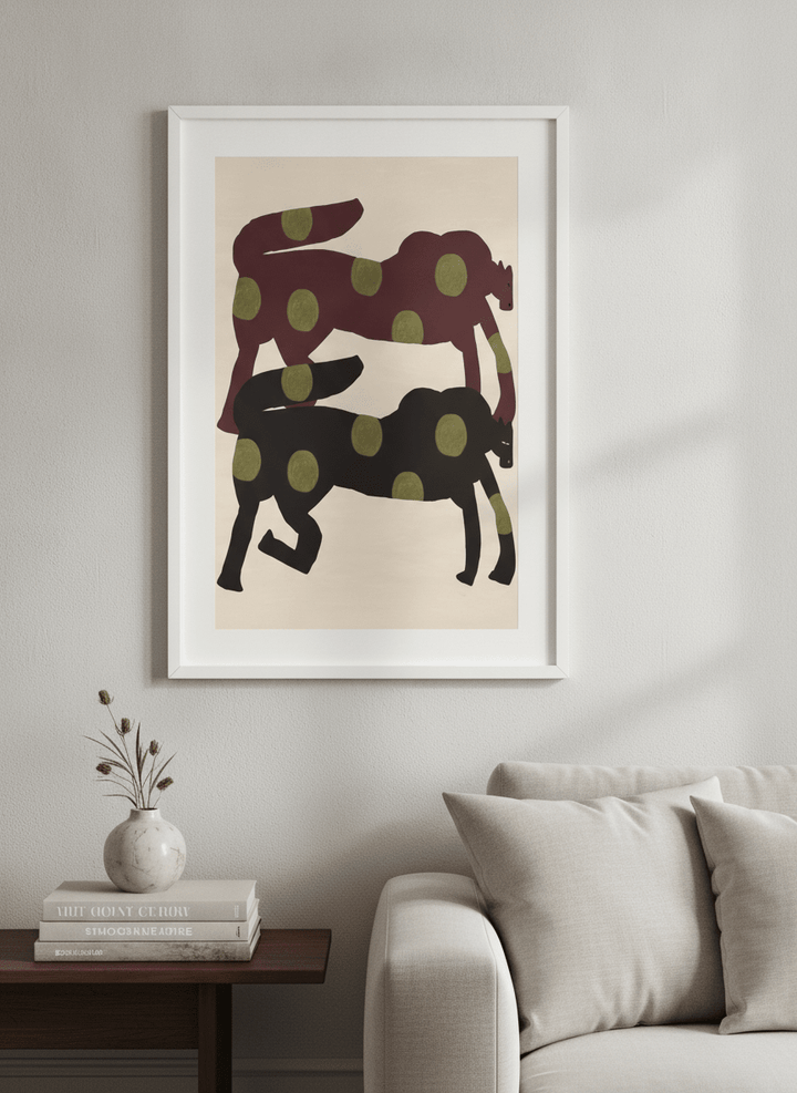 Modern wall art styled above a sofa in a neutral living room