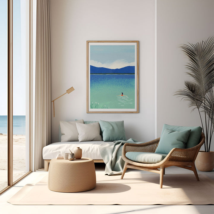 Modern living room with a sofa, armchair, and a painting of a beach scene.