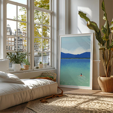 Living room with large window, indoor plants, and a picture of a lake.