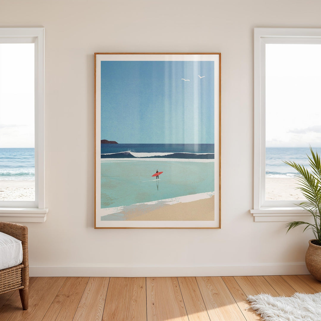 beach scene print on a wall with windows and a plant in the room.