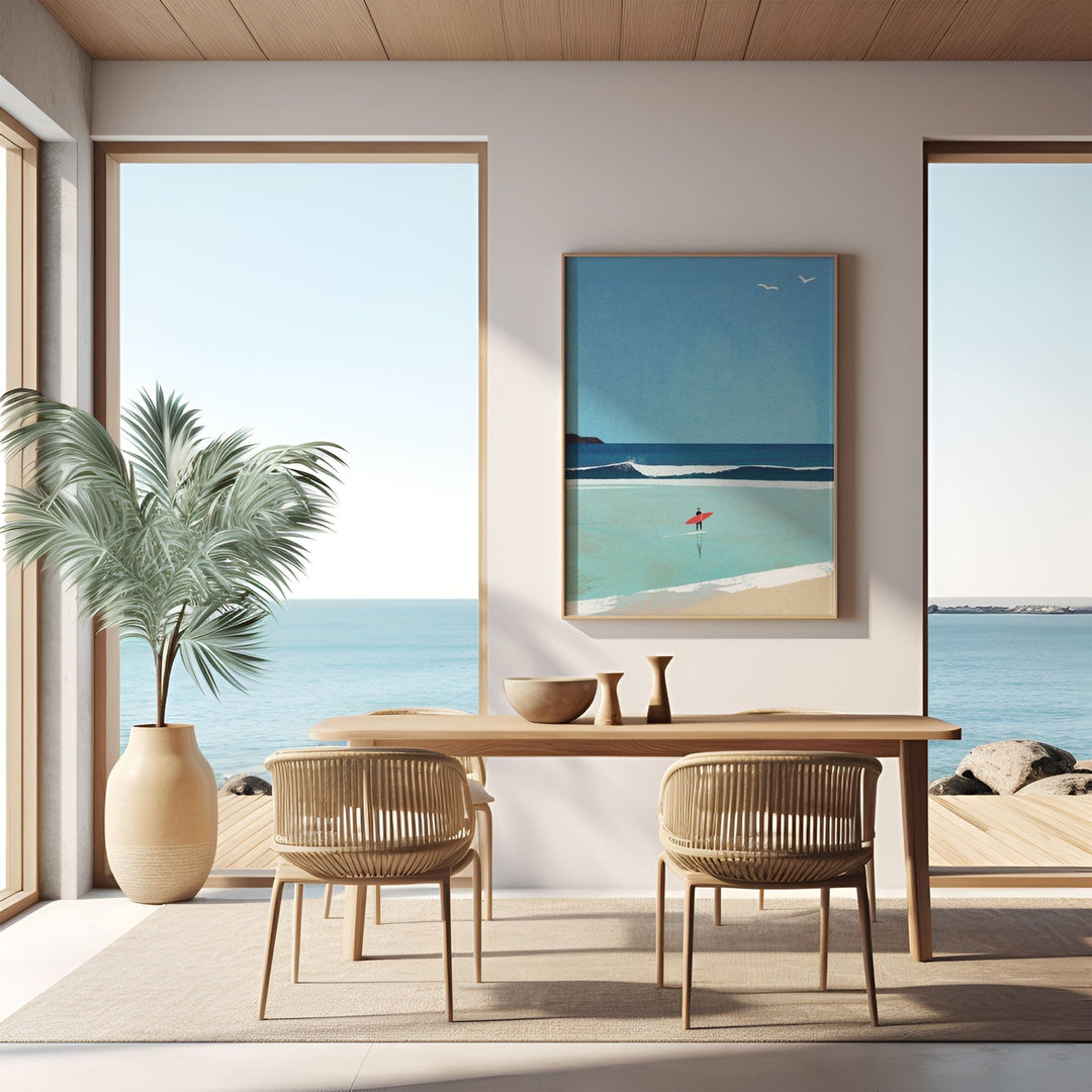 Modern dining room with ocean view, table, chairs, and beach-themed artwork.