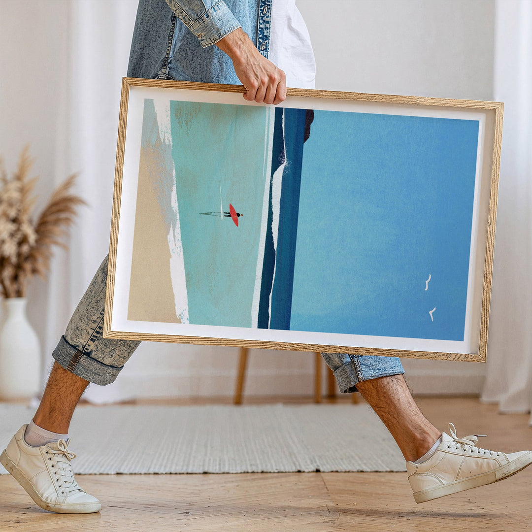Person holding abstract artwork with blue and green colors