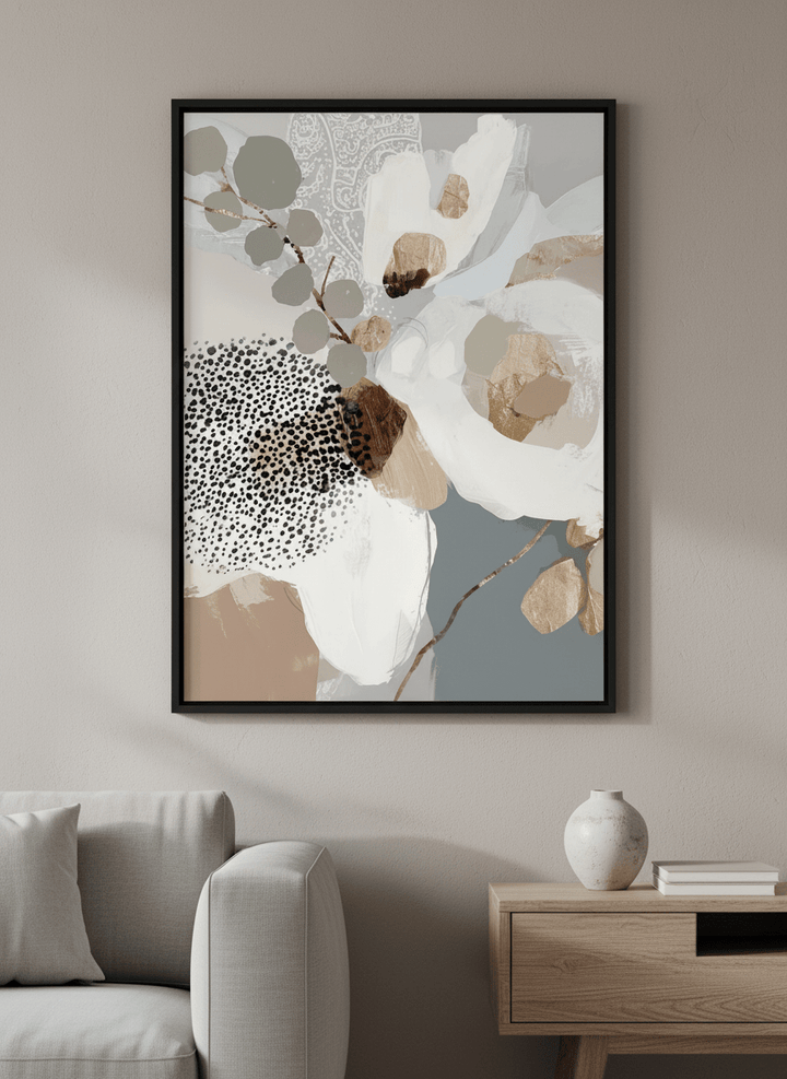 Modern wall art styled above a sofa in a neutral living room