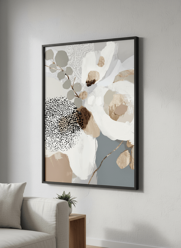 Modern wall art styled above a sofa in a neutral living room