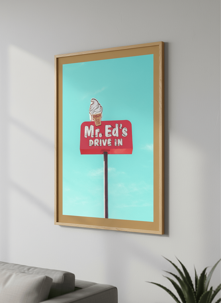 Modern wall art styled above a sofa in a neutral living room