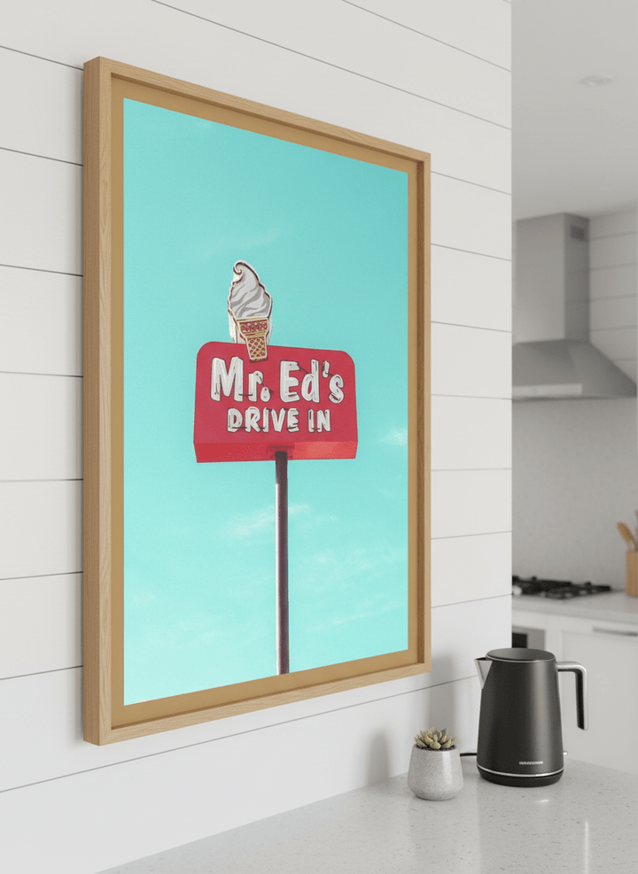 Artwork styled on the wall of a bright modern kitchen