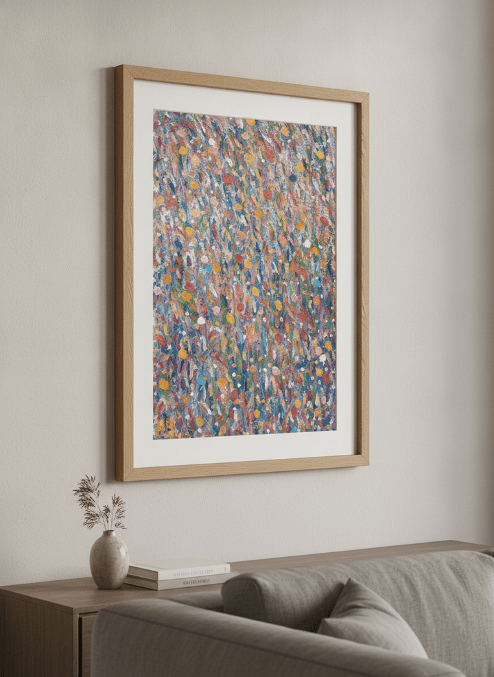 Modern wall art styled above a sofa in a neutral living room
