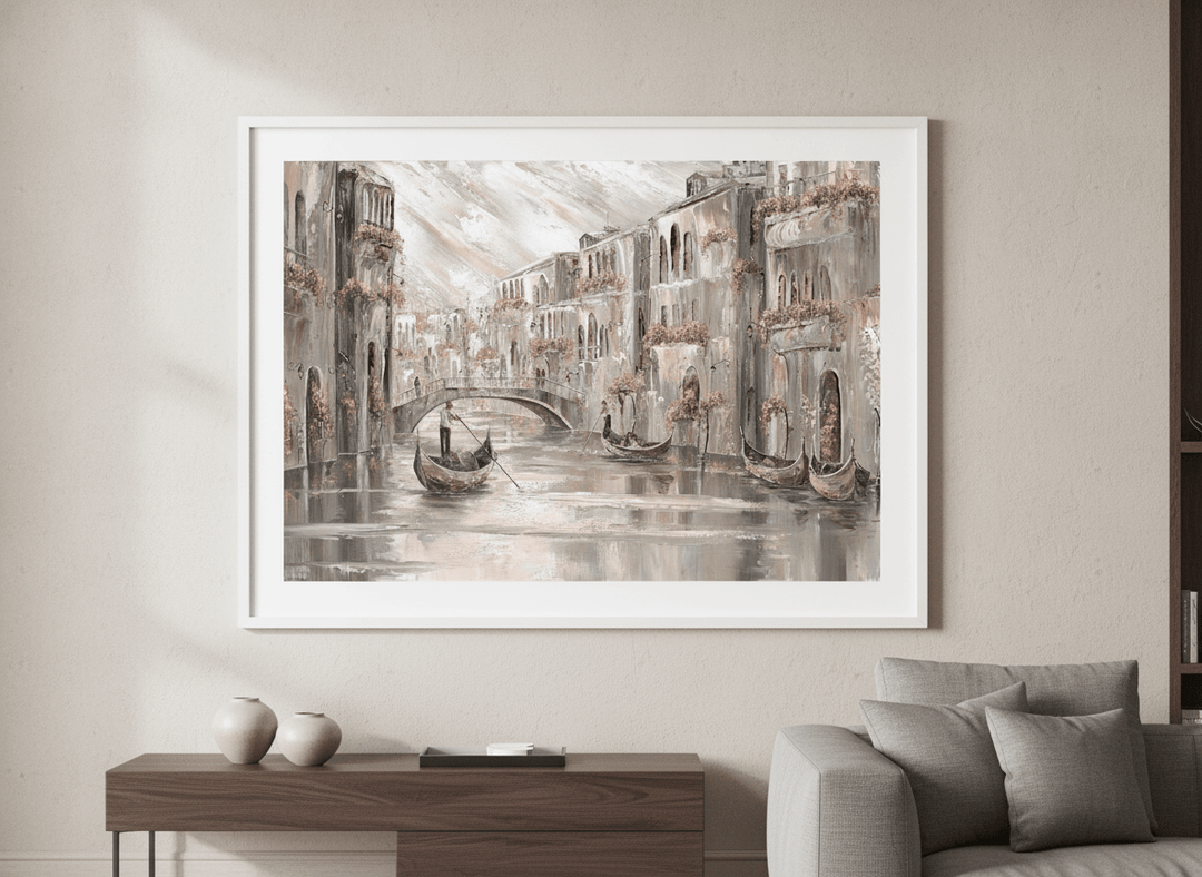 Modern wall art styled above a sofa in a neutral living room