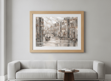 Modern wall art styled above a sofa in a neutral living room