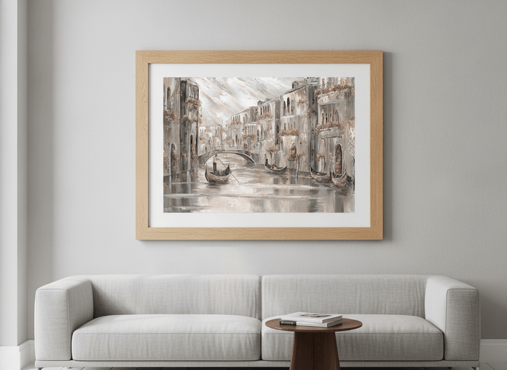 Modern wall art styled above a sofa in a neutral living room