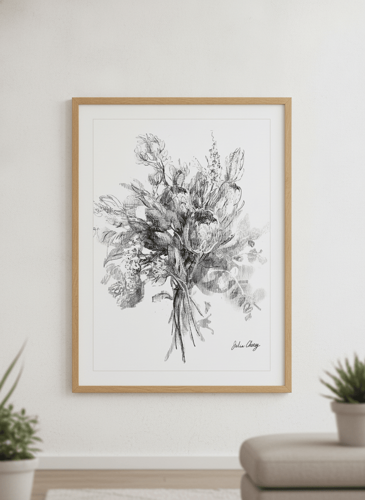 Modern wall art styled above a sofa in a neutral living room