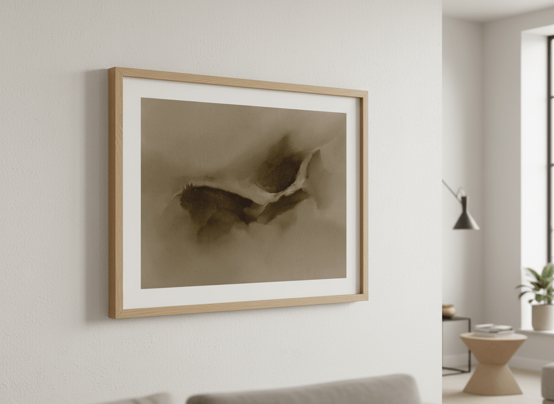 Modern wall art styled above a sofa in a neutral living room