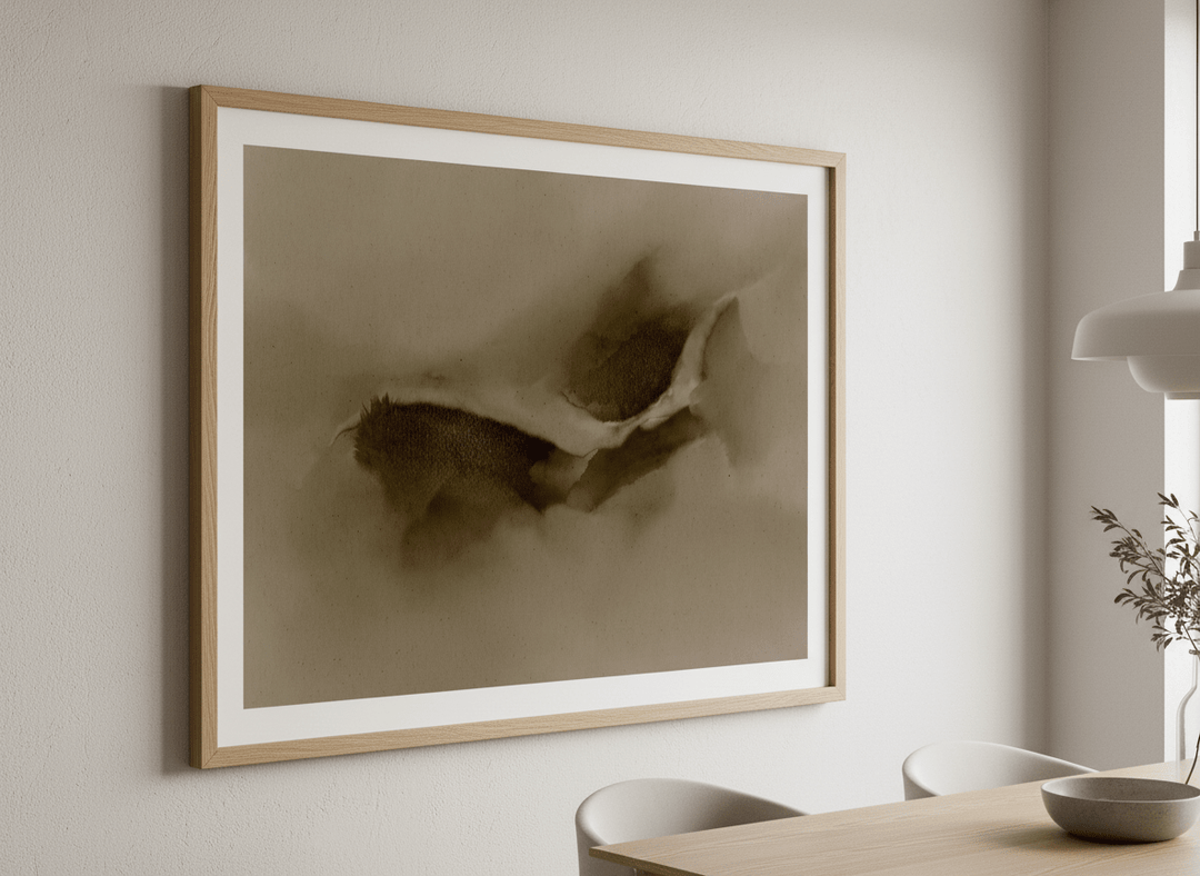 Wall art styled above a dining table in a contemporary home