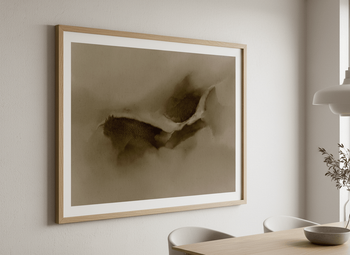 Wall art styled above a dining table in a contemporary home