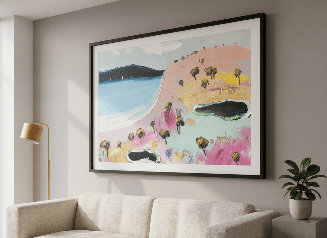 Modern wall art styled above a sofa in a neutral living room