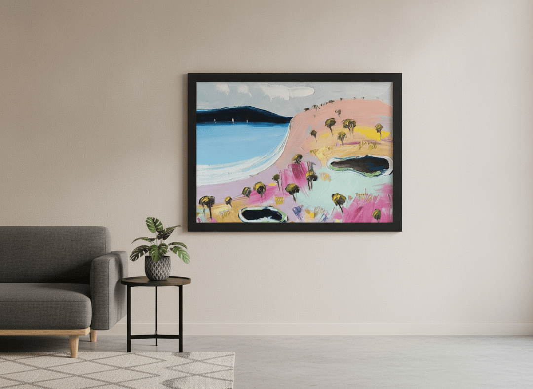 Modern wall art styled above a sofa in a neutral living room