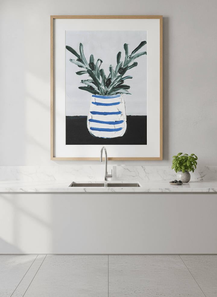 Artwork styled on the wall of a bright modern kitchen