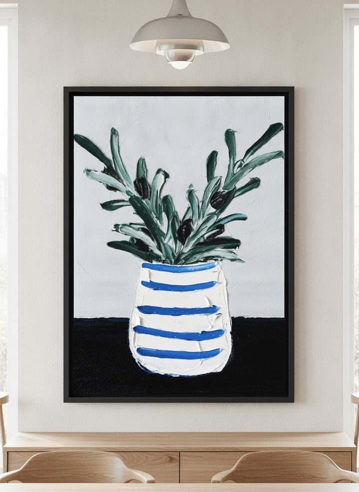 Wall art styled above a dining table in a contemporary home