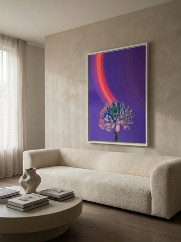 Oversized statement canvas wall art with a white surround styled on the wall in a luxe living room