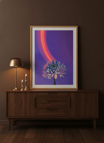 Modern wall art print standing on a sideboard in a moody home office
