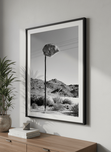 Modern wall art styled above a sofa in a neutral living room