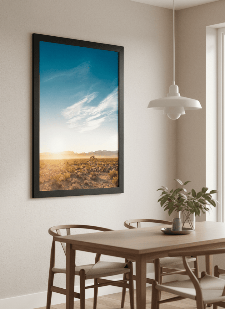 Wall art styled above a dining table in a contemporary home