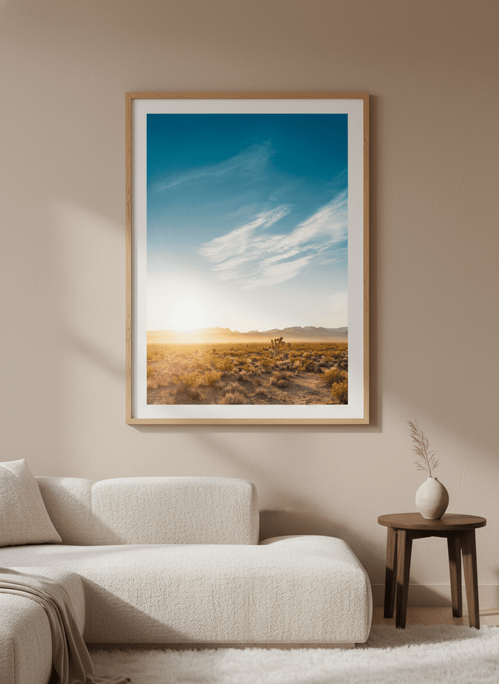 Modern wall art styled above a sofa in a neutral living room
