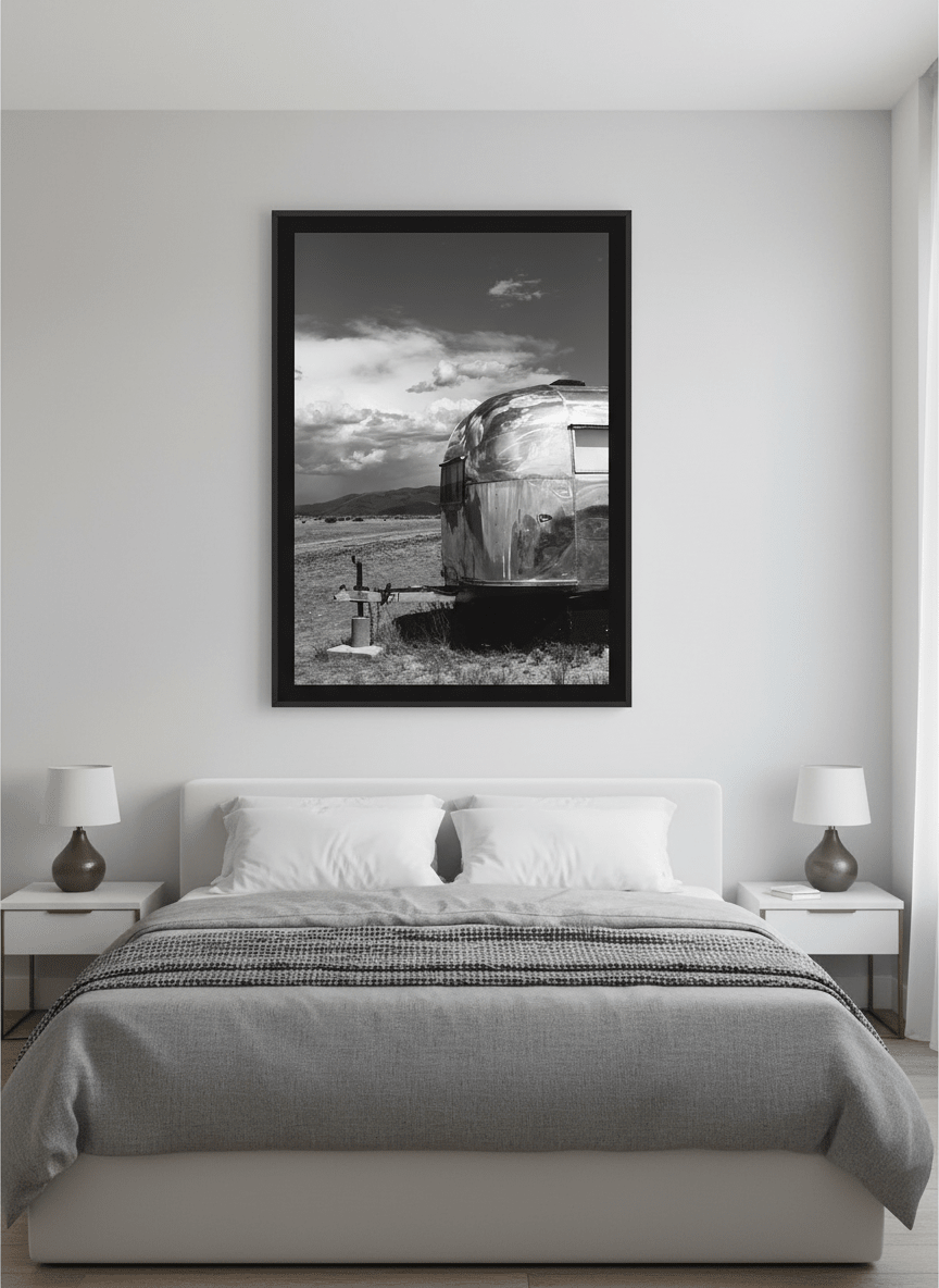Minimalist artwork displayed in a calm, light-filled bedroom interior
