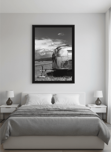 Minimalist artwork displayed in a calm, light-filled bedroom interior