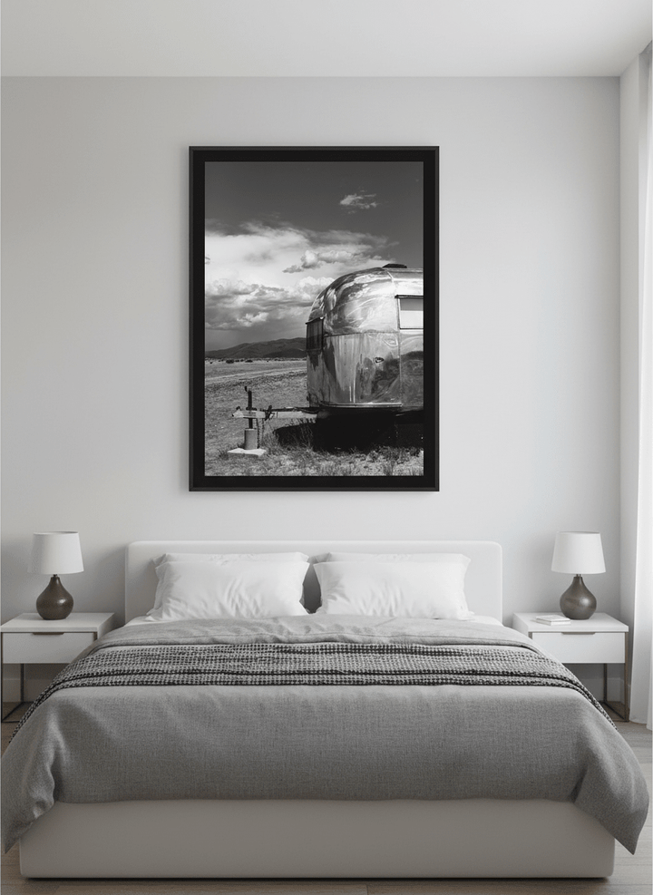 Minimalist artwork displayed in a calm, light-filled bedroom interior