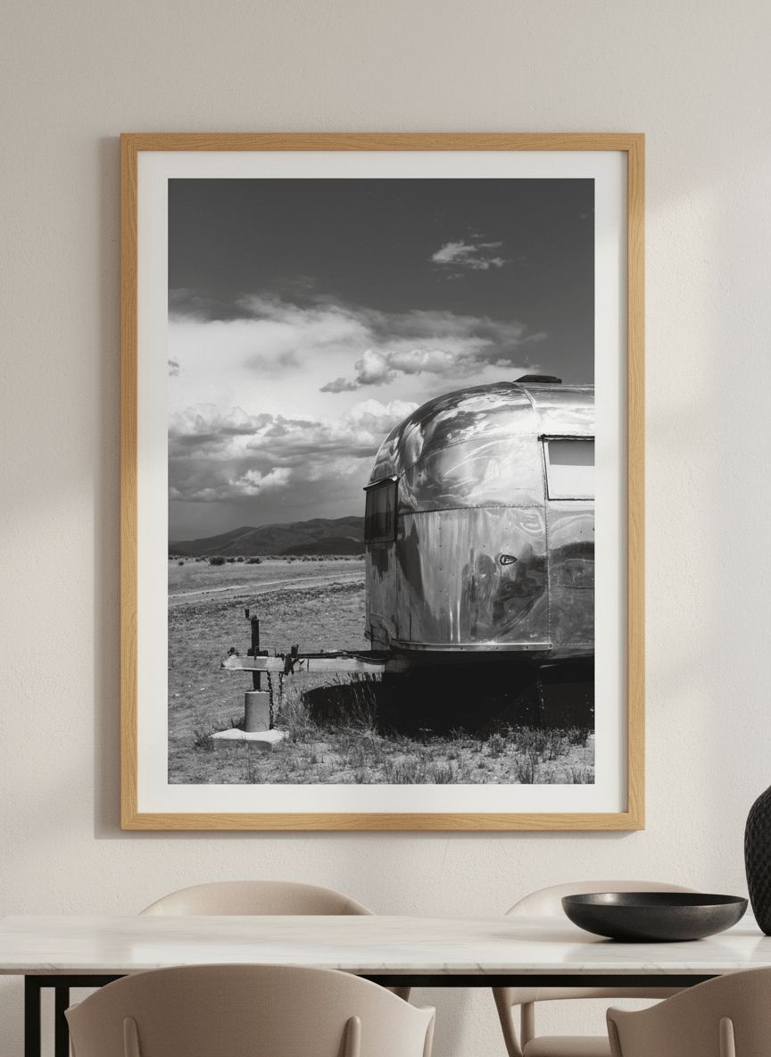 Wall art styled above a dining table in a contemporary home