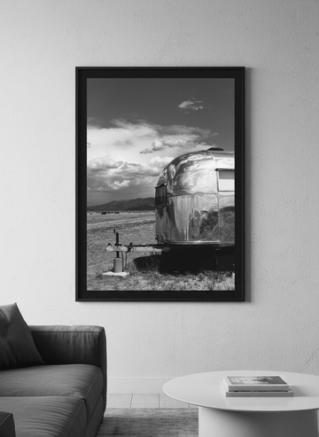 Modern wall art styled above a sofa in a neutral living room