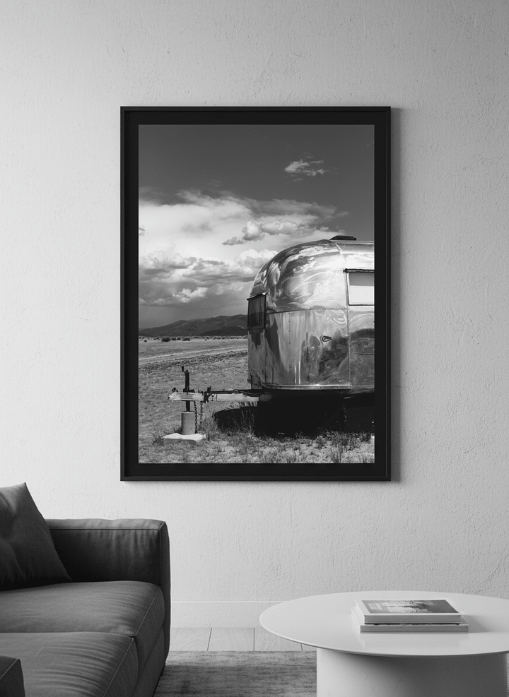 Modern wall art styled above a sofa in a neutral living room