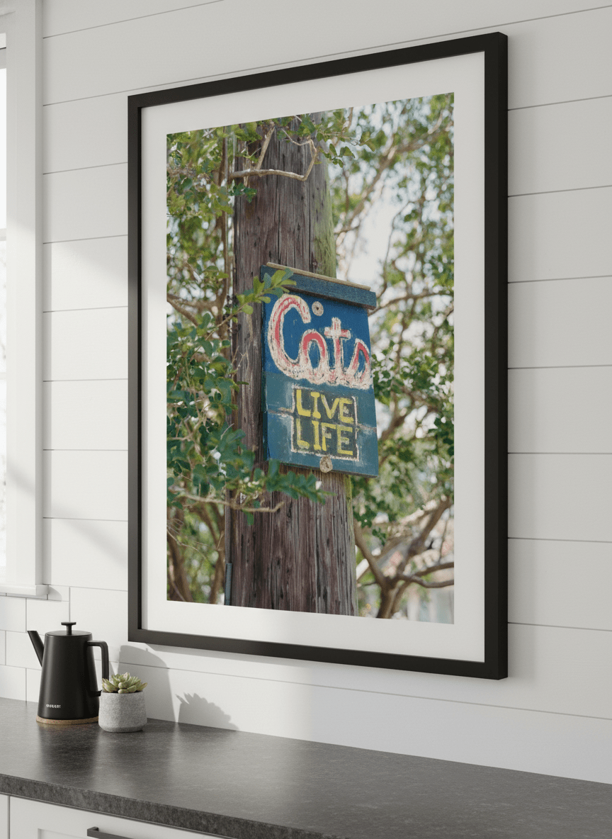 Artwork styled on the wall of a bright modern kitchen